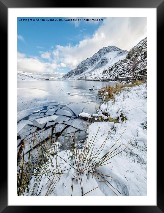 Frozen Ogwen Lake Snowdonia  Framed Mounted Print by Adrian Evans