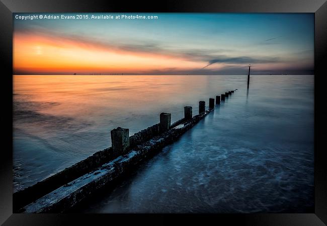 Chasing The Sunset Framed Print by Adrian Evans
