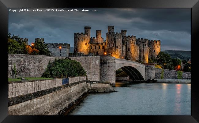 Conwy Castle by Lamplight Framed Print by Adrian Evans