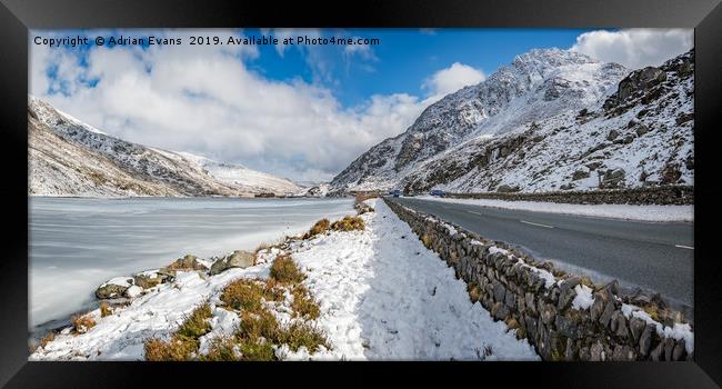 Frozen Lake Snowdonia Framed Print by Adrian Evans
