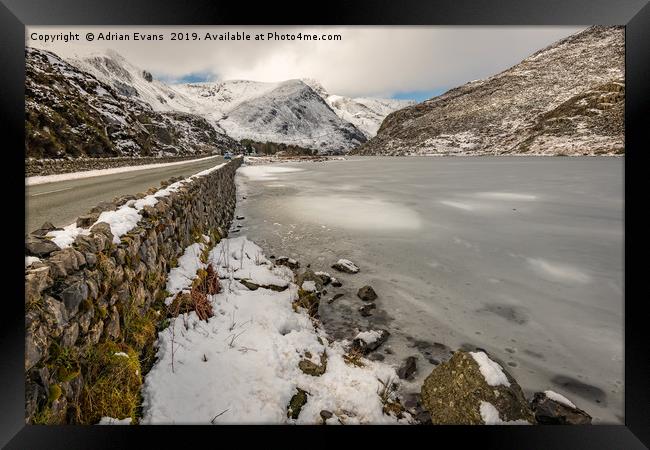Icy Lake Ogwen Snowdonia Framed Print by Adrian Evans