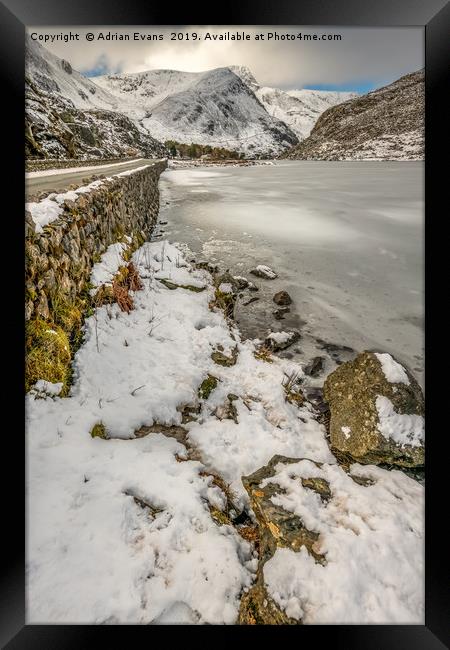 Icy Ogwen Lake Snowdonia Framed Print by Adrian Evans