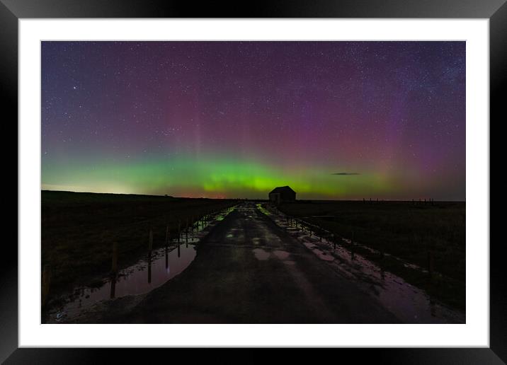 Northern lights dancing over the old coal barn at Thornham  Framed Mounted Print by Gary Pearson