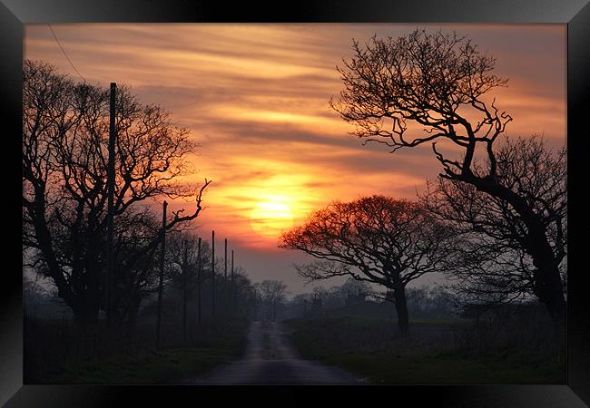 Sunset over Ringstead Framed Print by Gary Pearson
