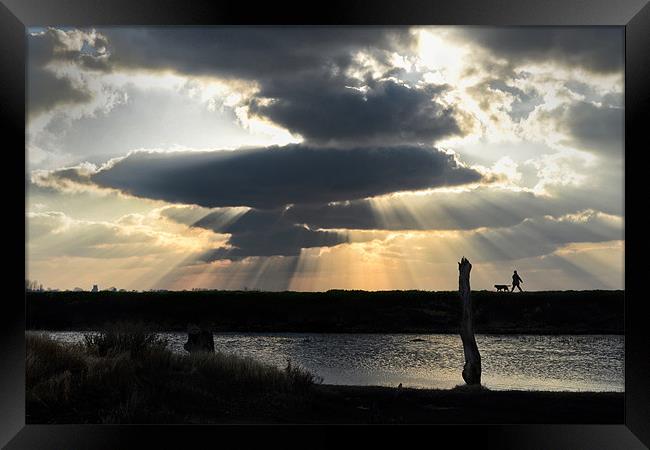 Walking under the god rays Framed Print by Gary Pearson