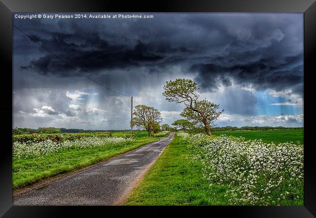 Storm clouds over Ringstead Framed Print by Gary Pearson