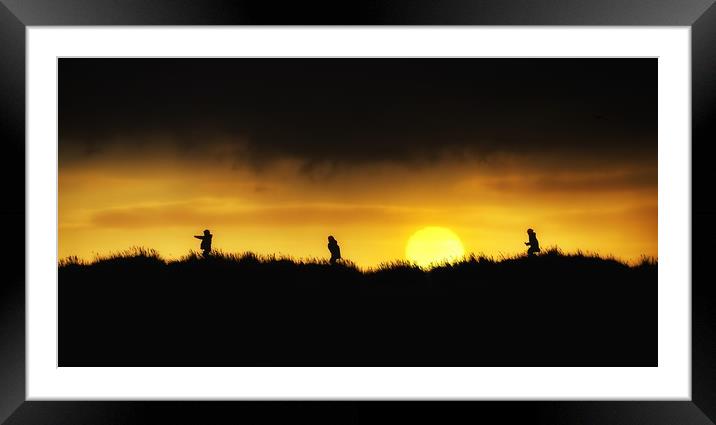 Fun in the sand dunes at sunset Framed Mounted Print by Gary Pearson