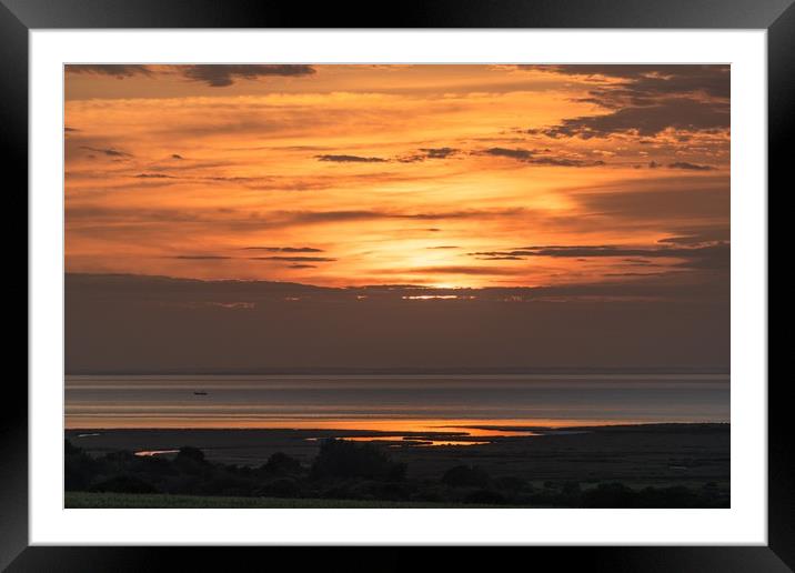 A Fishing boat at sunset off the coast near Thornh Framed Mounted Print by Gary Pearson