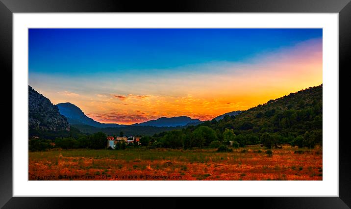 Sun melts behind Pollensa Mountains Framed Mounted Print by Trevor Camp