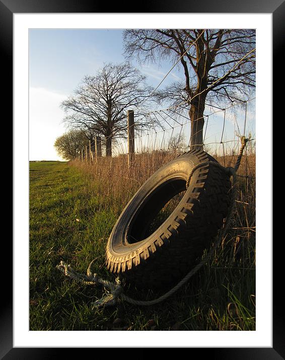 tire at sunset Framed Mounted Print by isaac ford