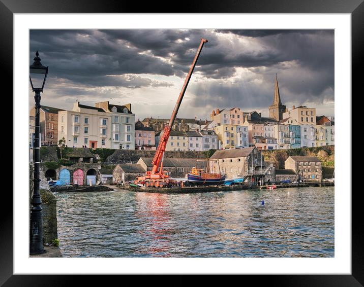 Putting the boats in Tenby Harbour Framed Mounted Print by Paul Deverson