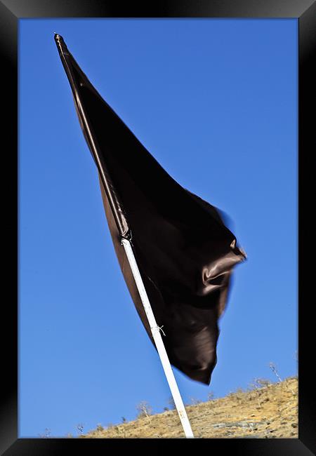 Black flag waving in a breeze Framed Print by Arfabita  