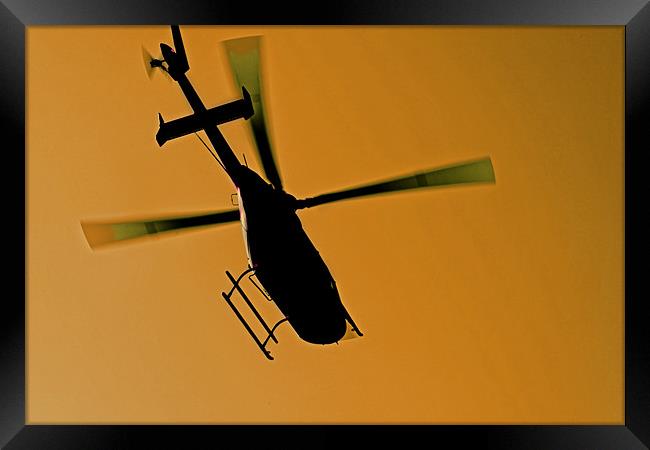 helicopter silhouette in flight Framed Print by Arfabita  