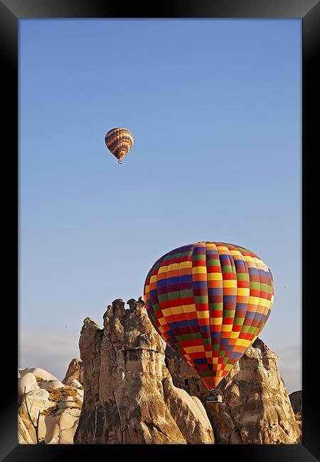 Hot air balloons on the rocks Framed Print by Arfabita  