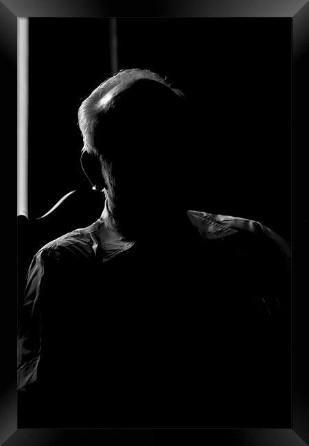 Silhouette of a senior man Framed Print by Arfabita  