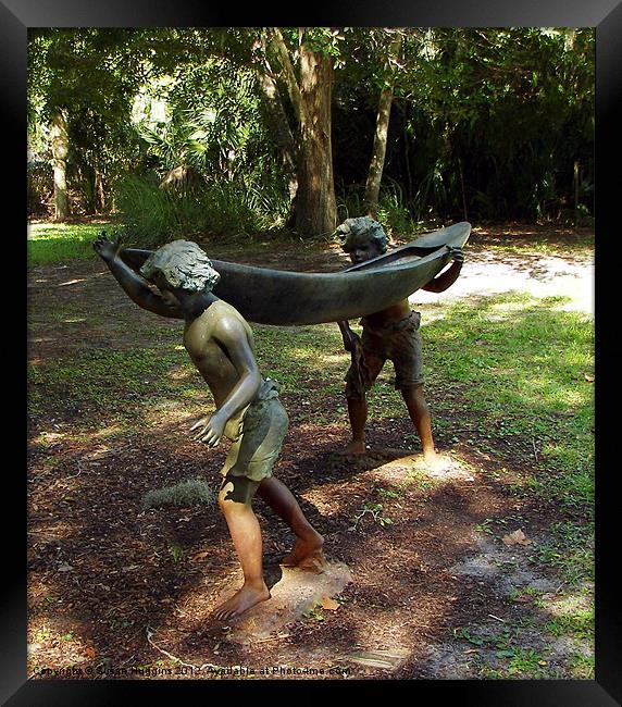 Bronze Boy and their canoe Framed Print by Susan Medeiros