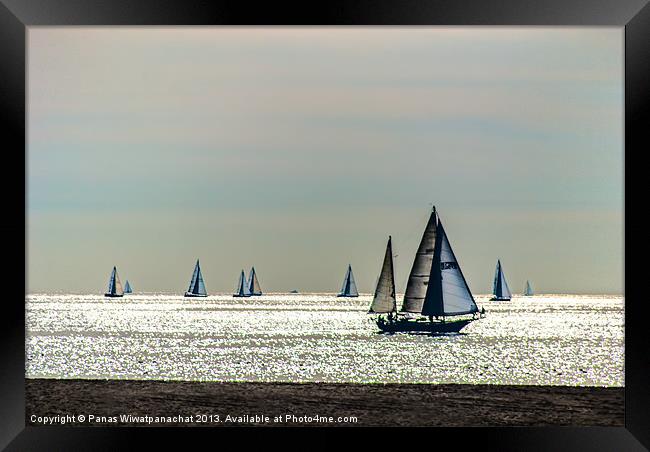 Sailboats and the Golden Sea Framed Print by Panas Wiwatpanachat