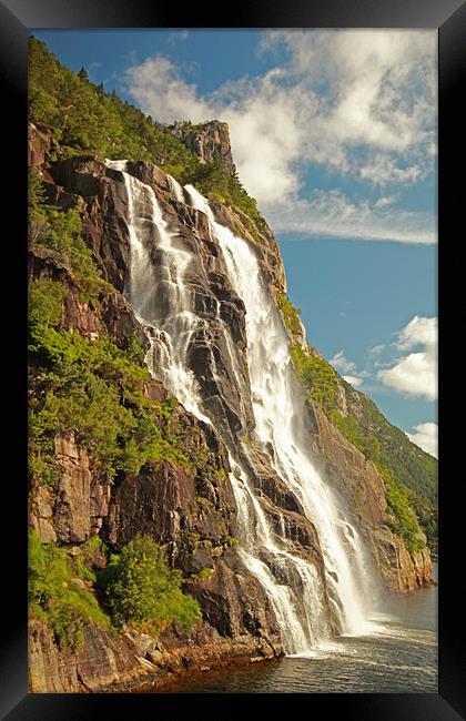 Waterfall in the Fjord Framed Print by Simon Rose