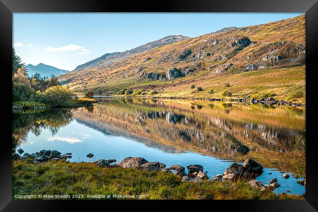 A Calm reflective Lake Framed Print by Mike Shields
