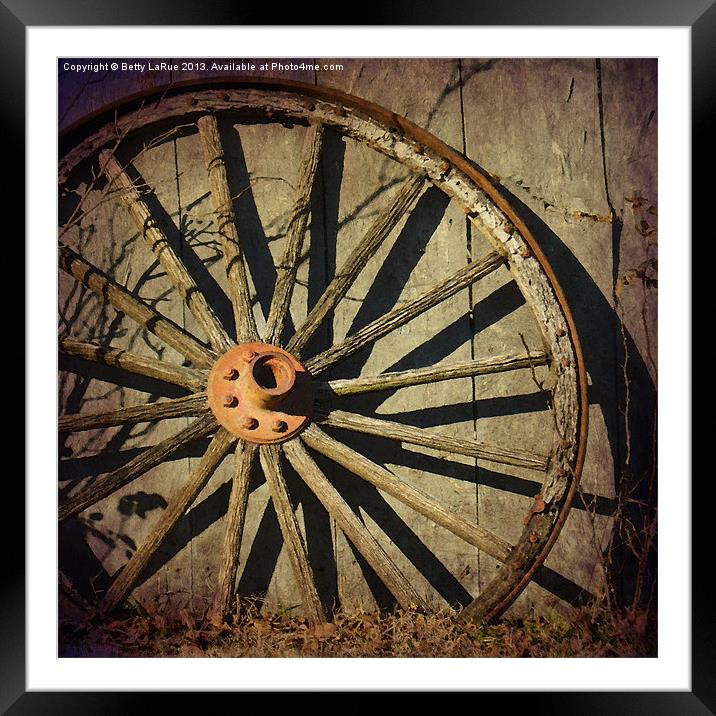 Old West Wagon Wheel Framed Mounted Print by Betty LaRue