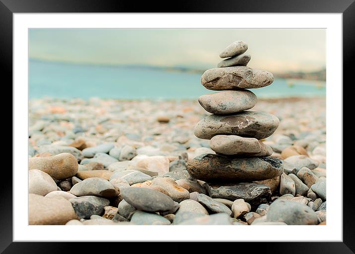 Pebble Tower on the beach Framed Mounted Print by Andrew Lee
