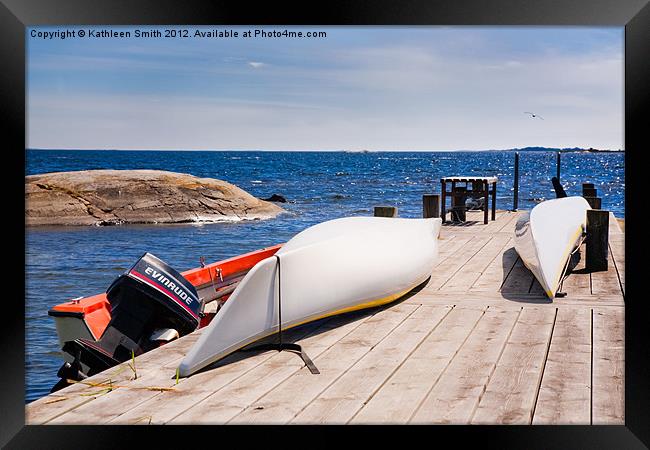 Kayaks on a jetty Framed Print by Kathleen Smith (kbhsphoto)