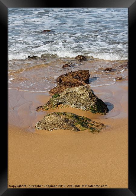 Rocks in the surf on Ramla Bay Framed Print by Christopher Chapman