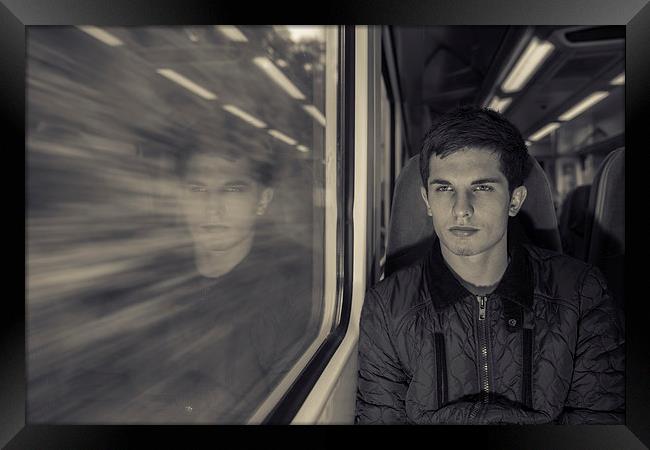 Man on a train Framed Print by Jonny Essex