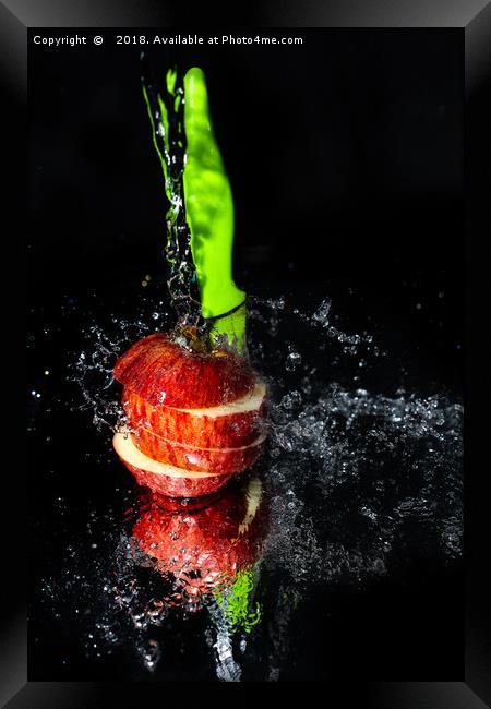Fresh Apple slices drenched with water Framed Print by Jonny Essex