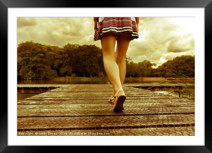 Lady with a perfect figure walking on a jetty Framed Mounted Print by Jonny Essex