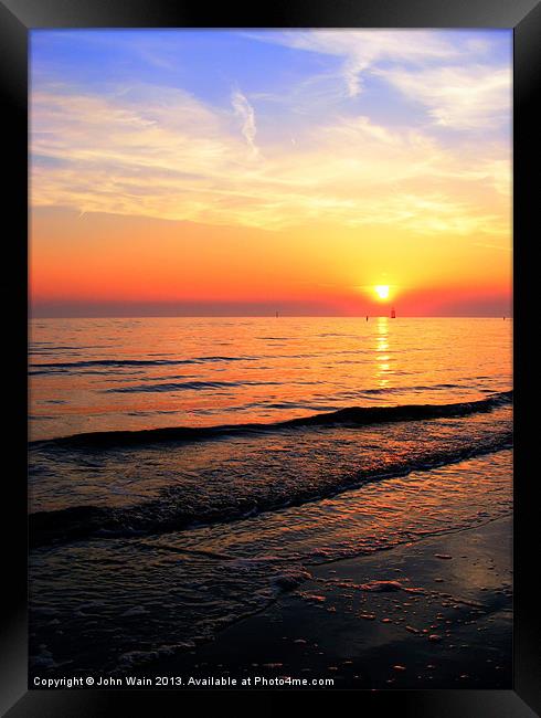 High tide and Sunset Framed Print by John Wain