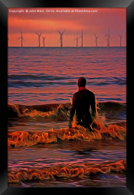 In the surf at Sunset Framed Print by John Wain