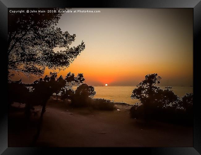 Ibiza Sunset Framed Print by John Wain