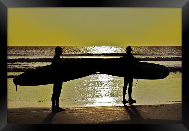 Surfers Framed Print by Paul Hutchings 