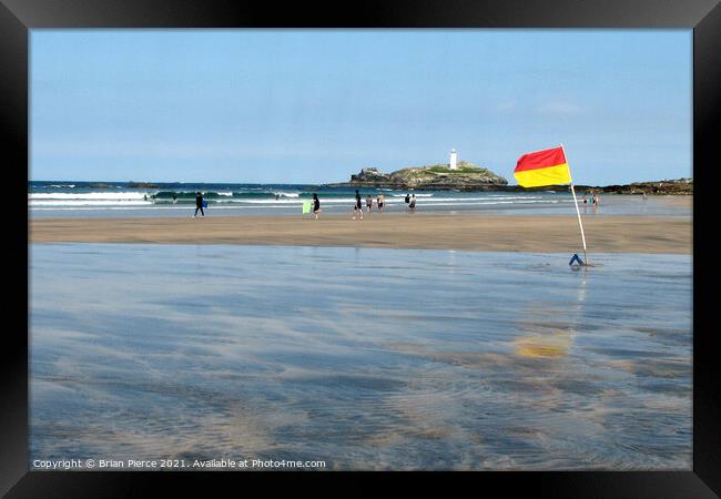 Surfers at Godrevy Lighthouse Framed Print by Brian Pierce