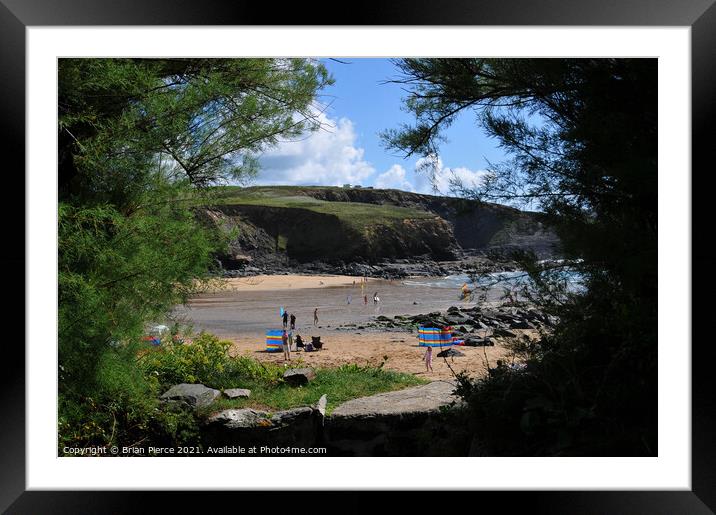View through the hedge to Church Cove from the chu Framed Mounted Print by Brian Pierce