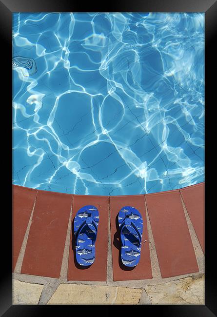 Flip flops by the pool Framed Print by Stephen  Hewett