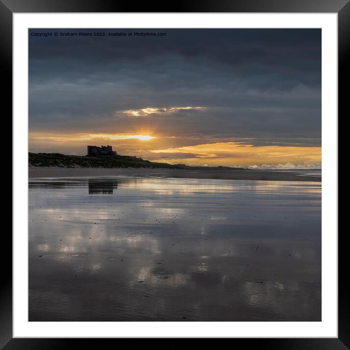 Bamburgh Castle from the south sunset Framed Mounted Print by Graham Moore