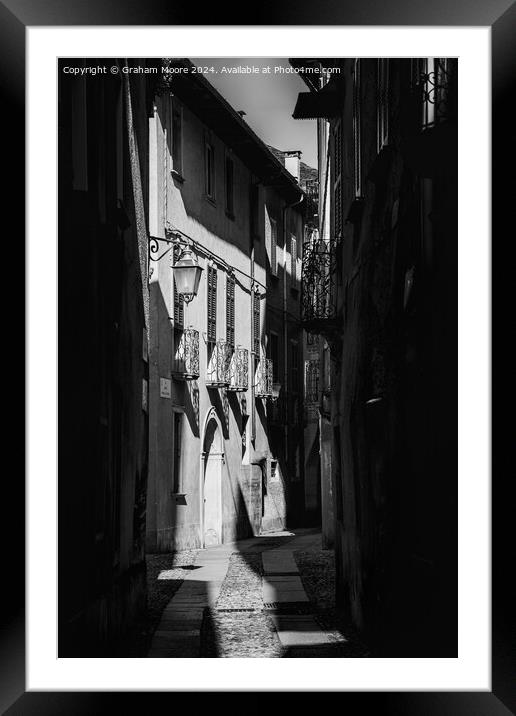 Old street in Orta Italy monochrome Framed Mounted Print by Graham Moore