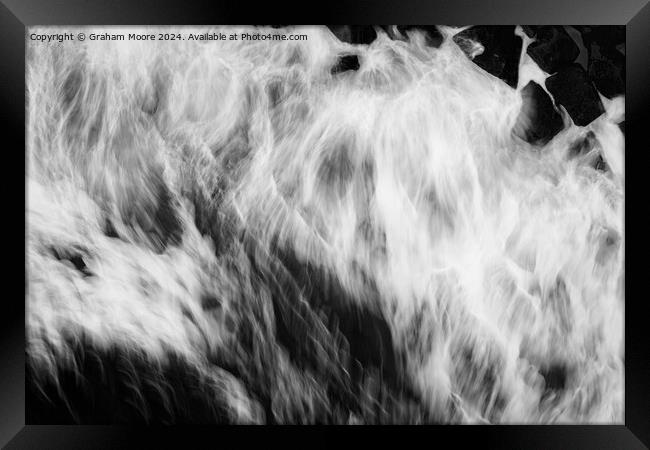 Waves crashing on rocks Framed Print by Graham Moore