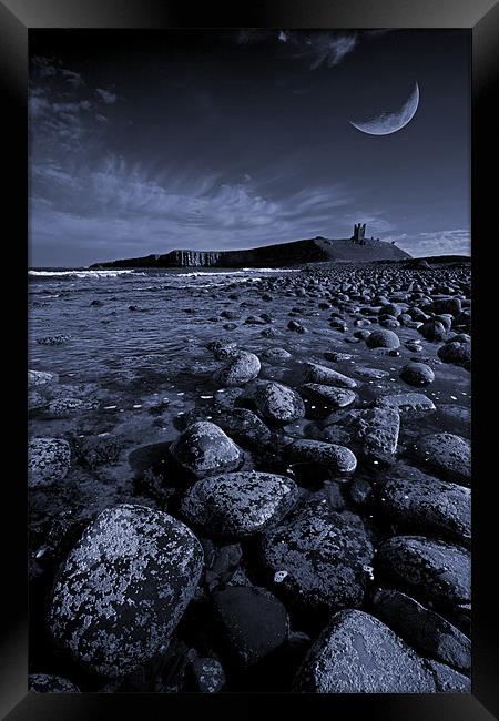 Dunstanburgh Castle with crescent moon Framed Print by Graham Moore