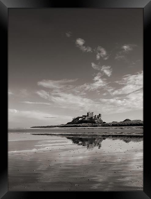 Bamburgh Castle reflections Framed Print by Graham Moore