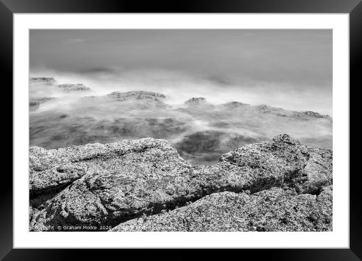 Waves on rocks monochrome Framed Mounted Print by Graham Moore