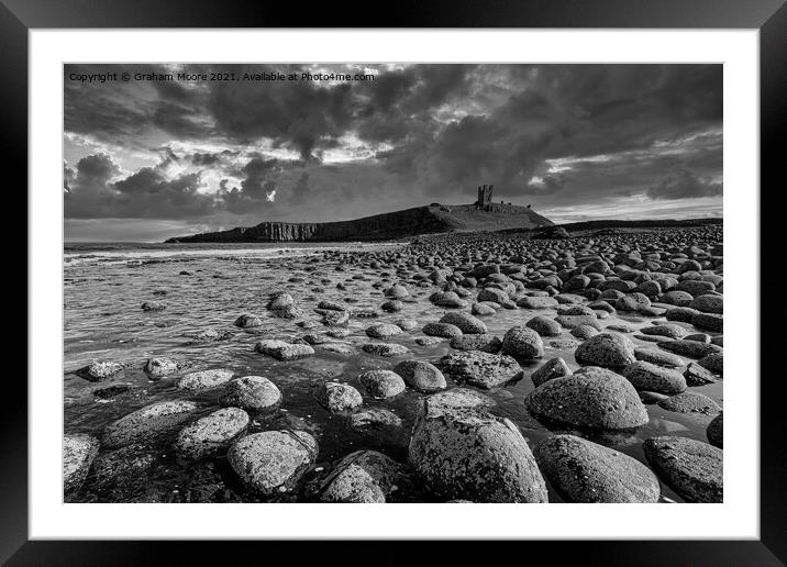 Dunstanburgh Castle from the north monochrome Framed Mounted Print by Graham Moore