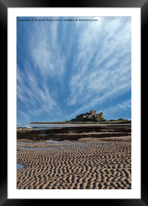 Bamburgh Castle with streaky clouds Framed Mounted Print by Graham Moore