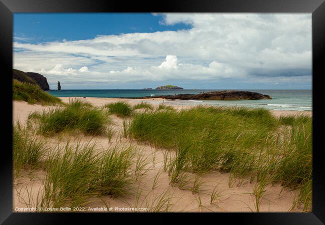 Sandwood Bay, Sutherland, Scotland looking from the sand dunes over the beach to the sea stack beyond Framed Print by Louise Bellin