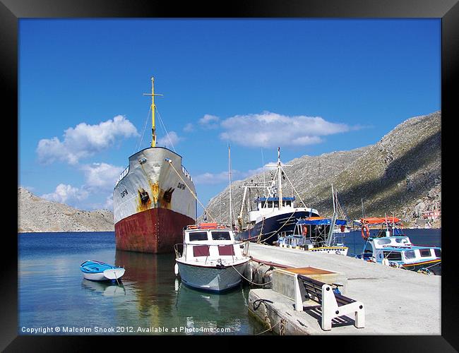 Cargo ship Dafni in Greece Framed Print by Malcolm Snook