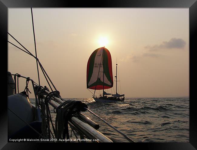 Yachts crossing at sea Framed Print by Malcolm Snook