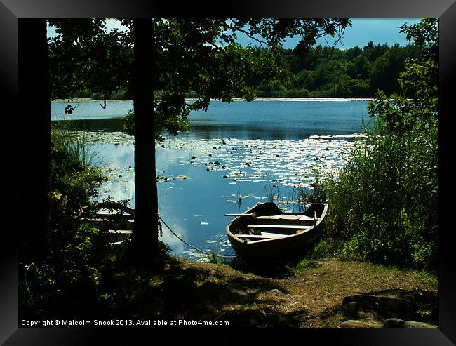 Swedish lake and rowing boats Framed Print by Malcolm Snook