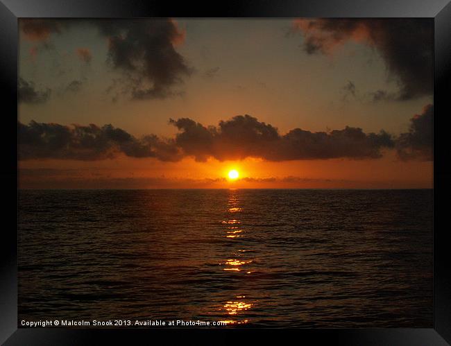 Sunrise at sea Framed Print by Malcolm Snook